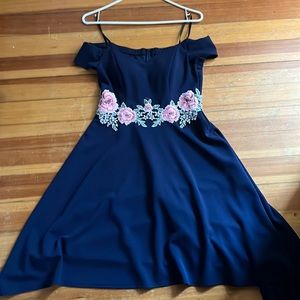 Formal navy blue off the shoulder dress with sowed flowers